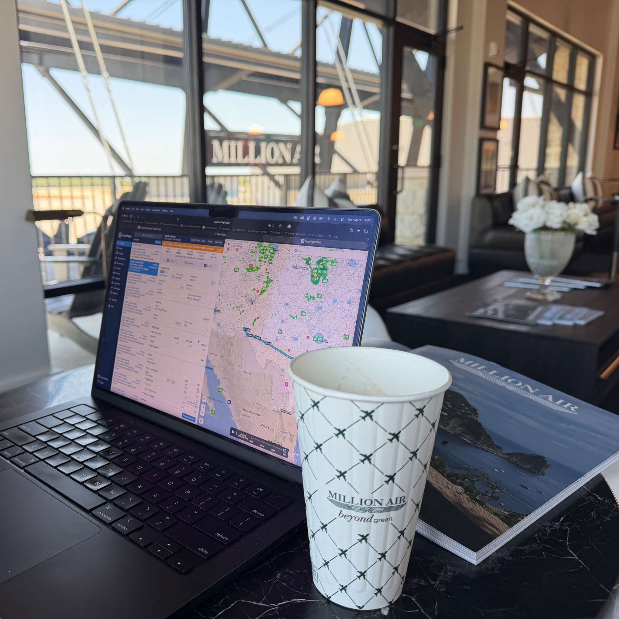 Flight planning on ForeFlight at a Million Air FBO lounge