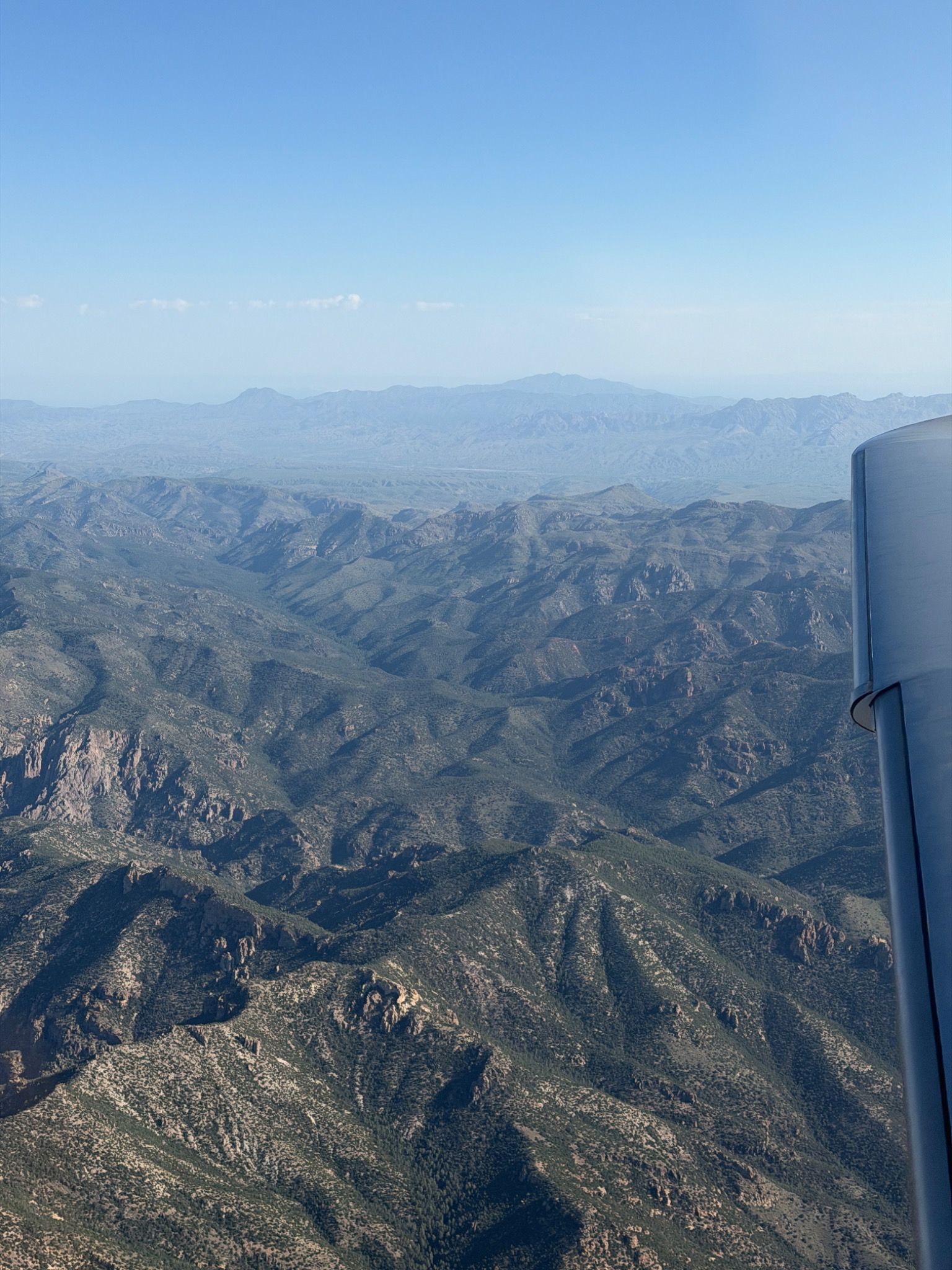 Rugged mountain terrain seen from an aircraft in flight