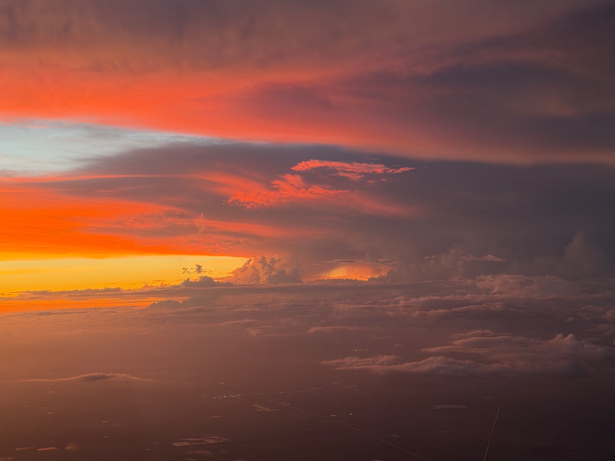Vivid red and orange sunset viewed from an aircraft in flight